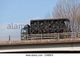 a-truck-full-of-old-tyres-for-recycling-and-or-disposal-travelling-en89f0.jpg