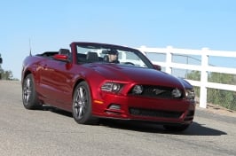 tmp_2014-Ford-Mustang-V8-Convertible-front-three-quarters-view-in-motion-1292713921.jpg