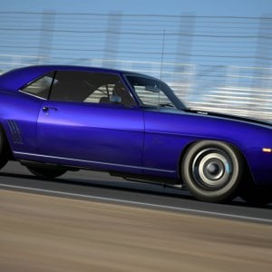 Black striped Camaro Z/28 speeding by Willow Springs - Big Willow.