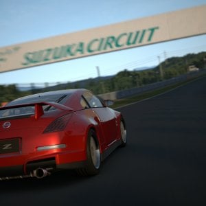 Opera Performance Gran Turismo Z putting down the metal at Suzuka's 200R.