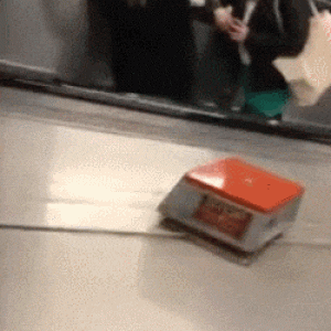 (GIF) Guys pretend to row up an escalator