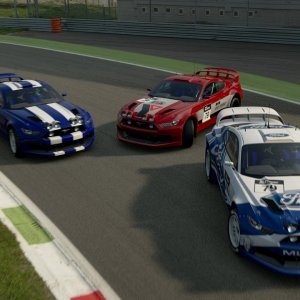 Three Mustangs, one corner.