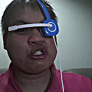 To pass the time, I took a picture of me looking like a fool, wearing my cheap-o headphones like a sci-fi villain.