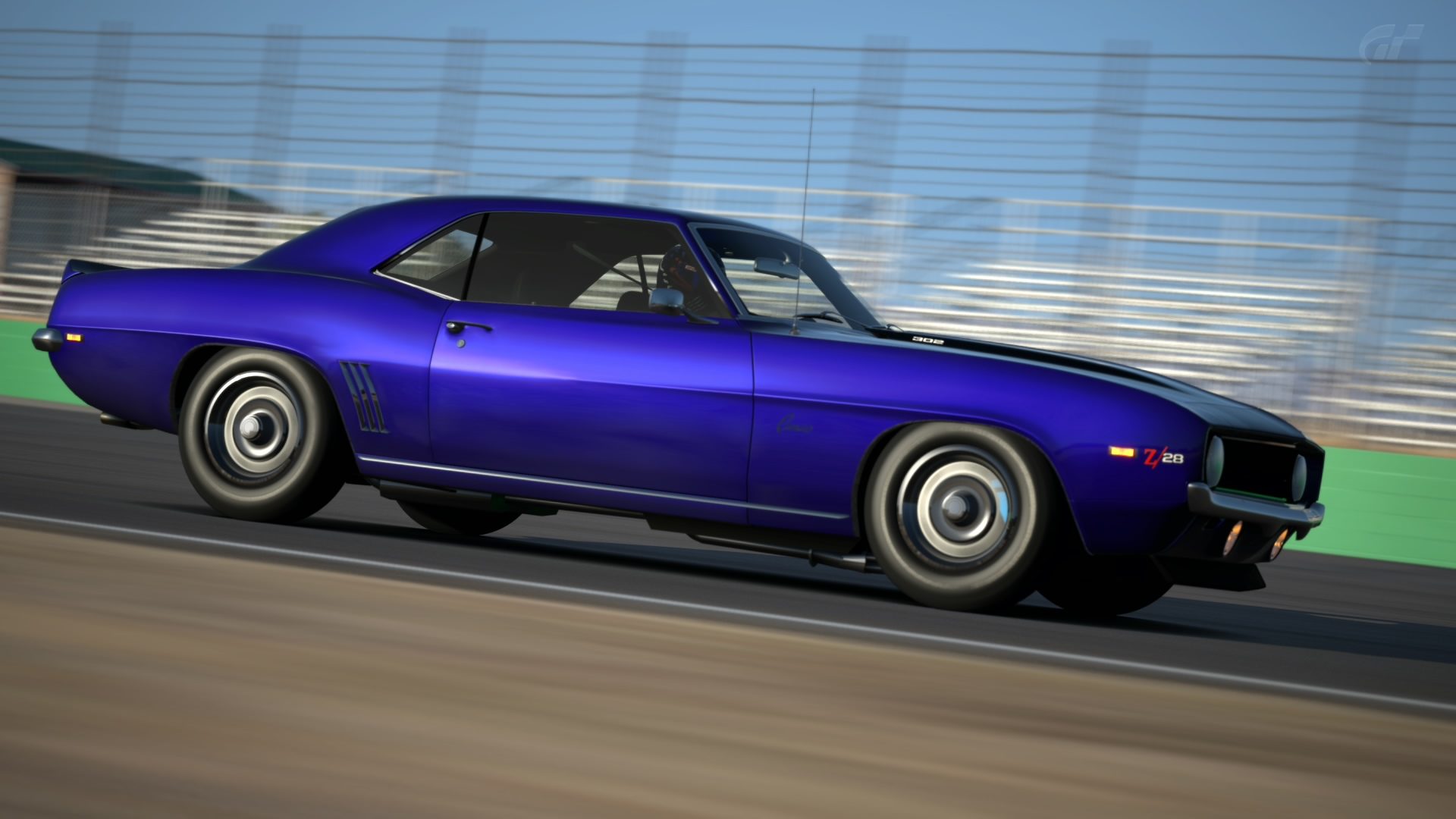 Black striped Camaro Z/28 speeding by Willow Springs - Big Willow.