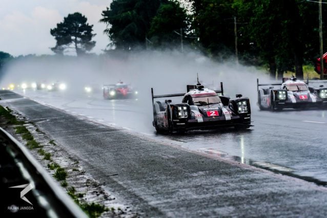 Two Porsche 919s leading the race in wet.